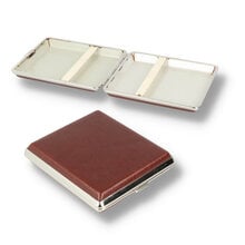 A picture of 2 cigarette cases, one is closed showing the leather effect finish and one is open showing the elasticated clasp inside.
