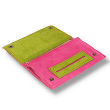 A pink and green suede wallet style pouch with paper dispenser