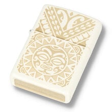 A cream coloured zippo with maori tattoo design