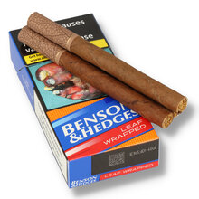 Two Benson & Hedges Leaf Wrapped Cigarillos resting on the branded pack of 10, highlighting the contrasting natural tobacco leaf wrappers.