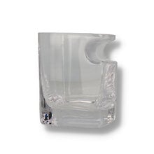 A square glass with cigsr rest cutout