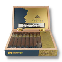 Open presentation box of 16 Macanudo Emissary France Toro cigars with branded interior, blend information card and individually cellophaned cigars.